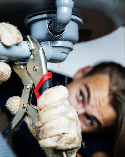 Man fixing kitchen sink